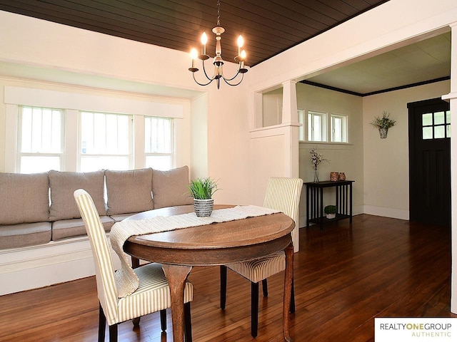 dining area featuring a chandelier and wood finished floors