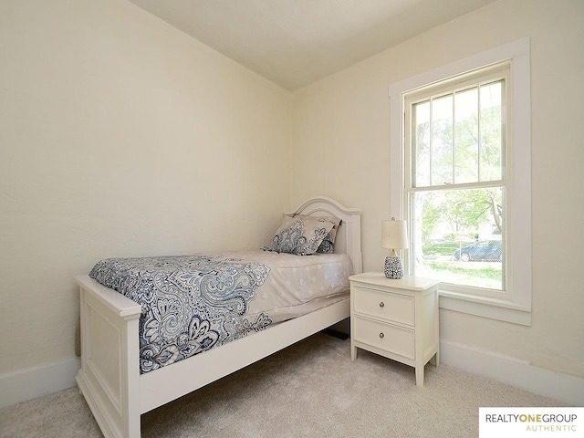 bedroom with light colored carpet