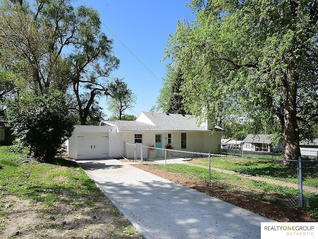 single story home featuring an attached garage, concrete driveway, and stucco siding