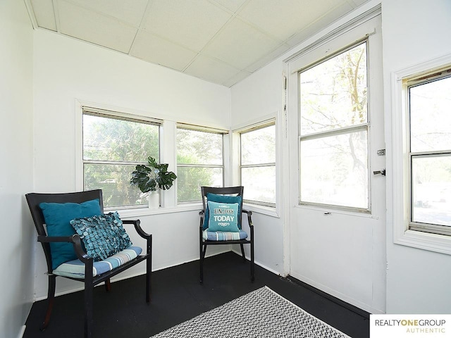 sunroom featuring plenty of natural light and wood finished floors