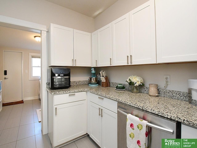 4210 S 21st St, Omaha, NE 68107 - kitchen with dishwasher, white cabinetry, and light stone counters