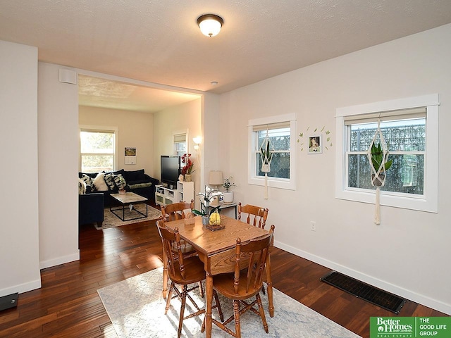 4210 S 21st St, Omaha, NE 68107 - dining area featuring wood-type flooring and baseboards