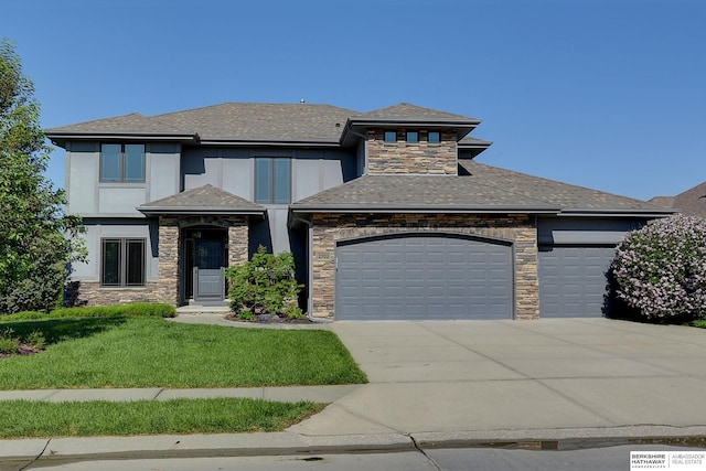 prairie-style home featuring an attached garage, stone siding, and driveway