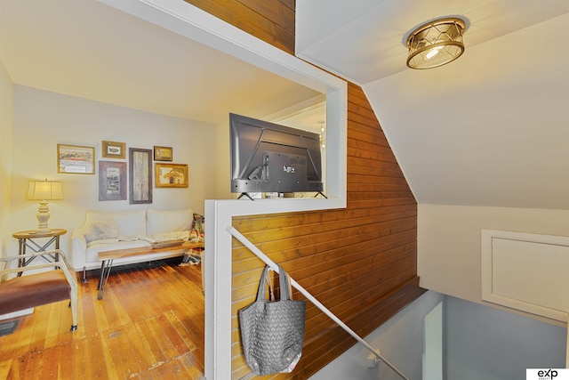 2939 Martha St, Omaha, NE 68105 - stairway with wood-type flooring, lofted ceiling, and wooden walls