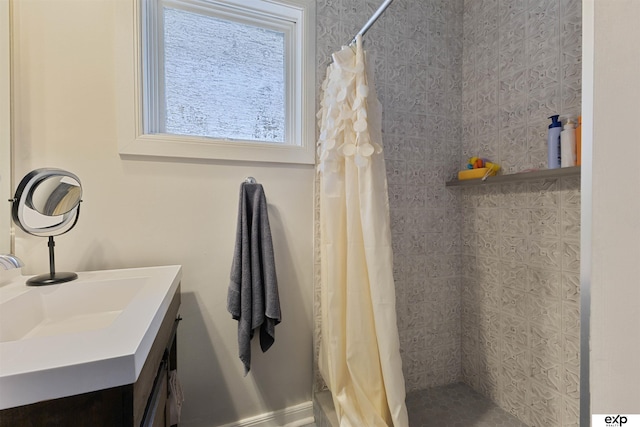 2939 Martha St, Omaha, NE 68105 - bathroom featuring a tile shower and vanity