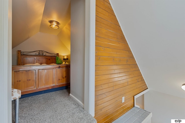 2939 Martha St, Omaha, NE 68105 - bedroom with lofted ceiling, carpet flooring, and wooden walls