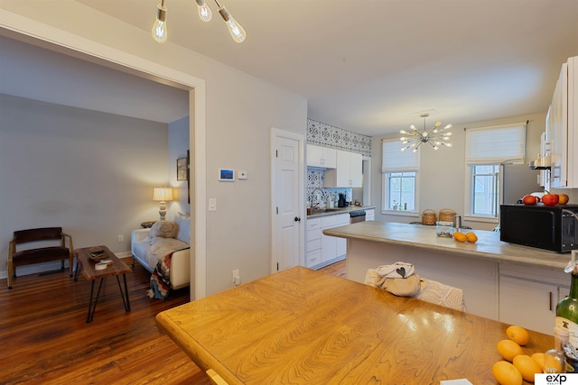 2939 Martha St, Omaha, NE 68105 - dining area with a chandelier and wood finished floors