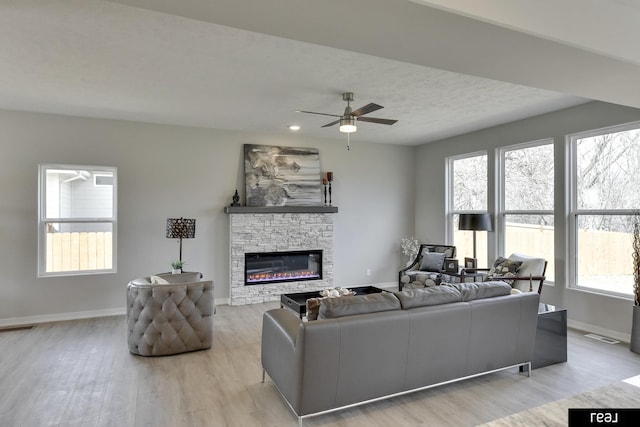 4406 Barksdale Dr, Bellevue, NE 68123 - living area with light wood-type flooring, healthy amount of natural light, and baseboards