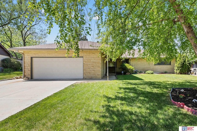 4511 E Eden St, Lincoln, NE 68506 - view of front of home featuring a garage, a front lawn, and concrete driveway