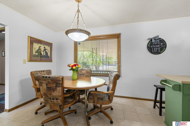 4511 E Eden St, Lincoln, NE 68506 - dining space with crown molding, baseboards, and light tile patterned floors