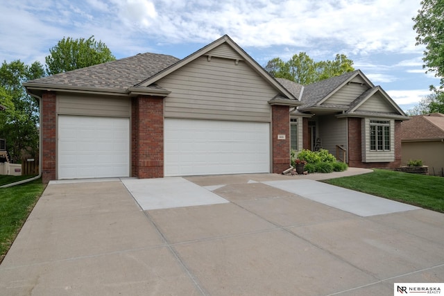 ranch-style home with a garage, concrete driveway, brick siding, and roof with shingles