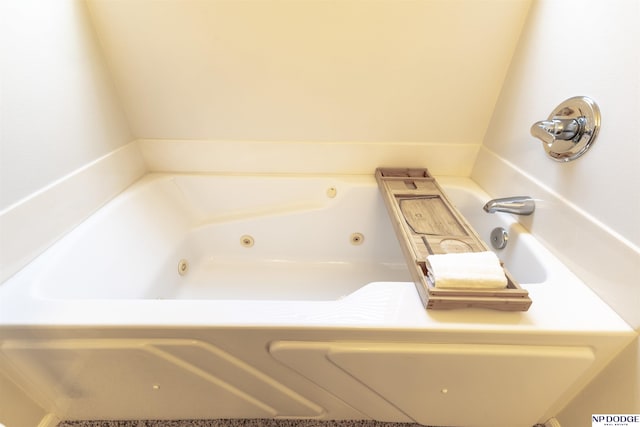 bathroom with a whirlpool tub