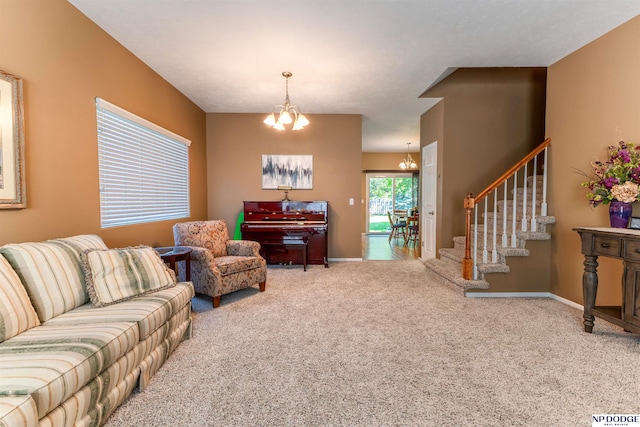 carpeted living area featuring a chandelier, stairway, and baseboards
