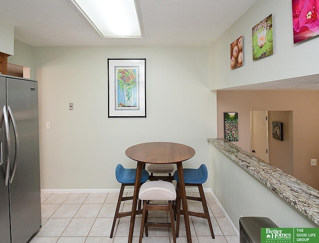14824 Charles Plz, Omaha, NE 68154 - dining space with baseboards and light tile patterned floors