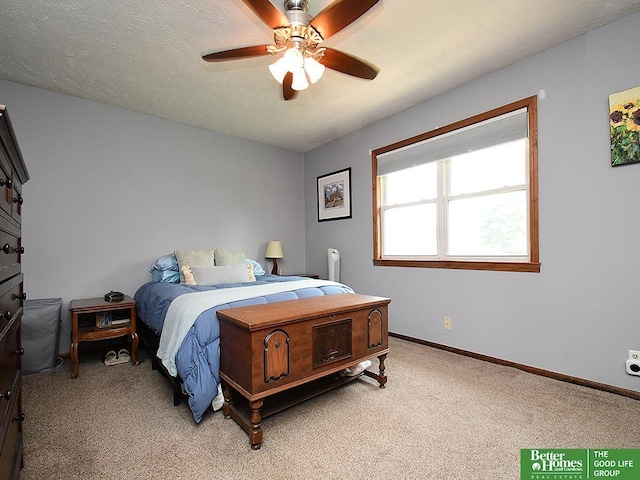 14824 Charles Plz, Omaha, NE 68154 - bedroom featuring light colored carpet, baseboards, and ceiling fan