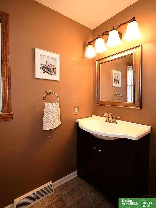 14824 Charles Plz, Omaha, NE 68154 - bathroom featuring vanity, wood finished floors, and baseboards
