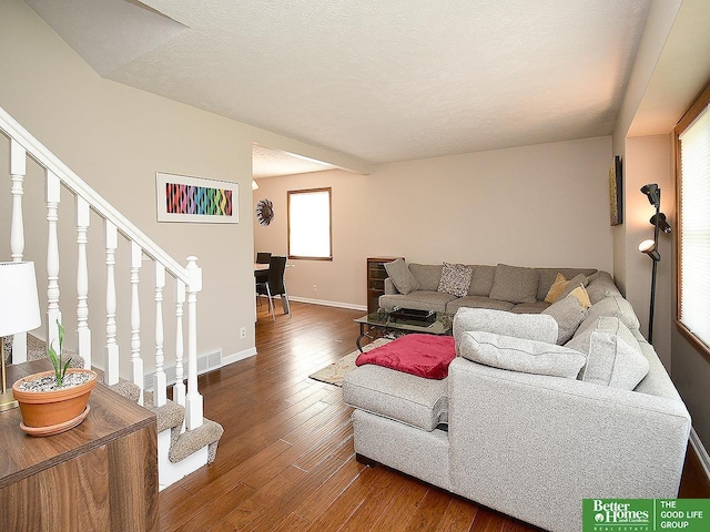 14824 Charles Plz, Omaha, NE 68154 - living room featuring wood-type flooring, baseboards, and stairway