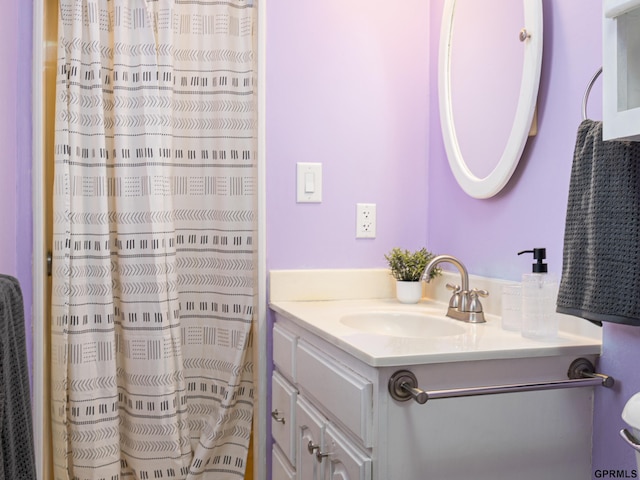 bathroom with vanity and curtained shower