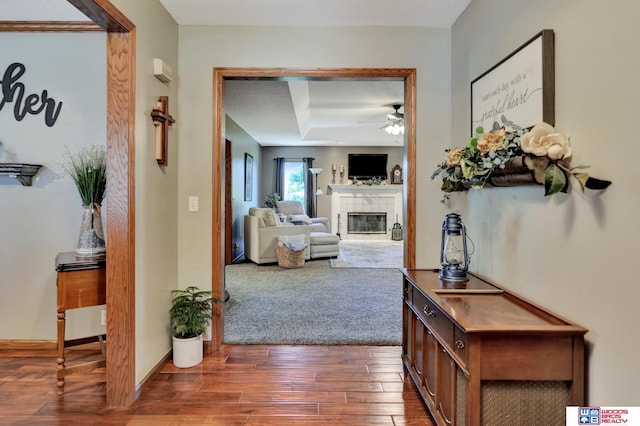 1714 S 14th Circle Dr, Beatrice, NE 68310 - hall featuring dark wood-type flooring and a tray ceiling