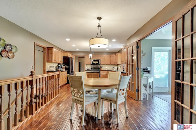 1714 S 14th Circle Dr, Beatrice, NE 68310 - dining area featuring wood-type flooring, recessed lighting, and french doors