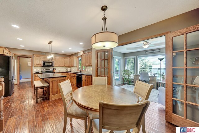 1714 S 14th Circle Dr, Beatrice, NE 68310 - dining room with wood finished floors, recessed lighting, and a ceiling fan
