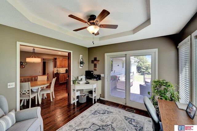 1714 S 14th Circle Dr, Beatrice, NE 68310 - office with a raised ceiling, a ceiling fan, dark wood-type flooring, and baseboards