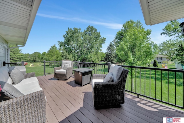 1714 S 14th Circle Dr, Beatrice, NE 68310 - deck featuring a lawn, an outdoor living space, and view of wooded area