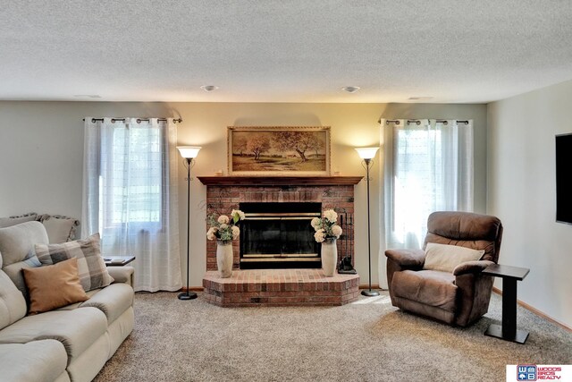 1714 S 14th Circle Dr, Beatrice, NE 68310 - living room with carpet floors, a fireplace, a textured ceiling, and baseboards
