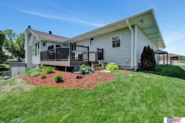1714 S 14th Circle Dr, Beatrice, NE 68310 - rear view of house featuring a yard and a deck