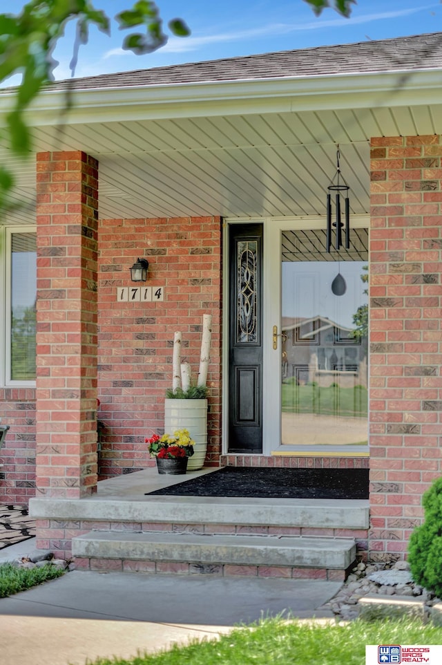 1714 S 14th Circle Dr, Beatrice, NE 68310 - property entrance featuring a porch and brick siding