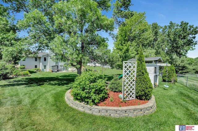 1714 S 14th Circle Dr, Beatrice, NE 68310 - view of yard with an outbuilding