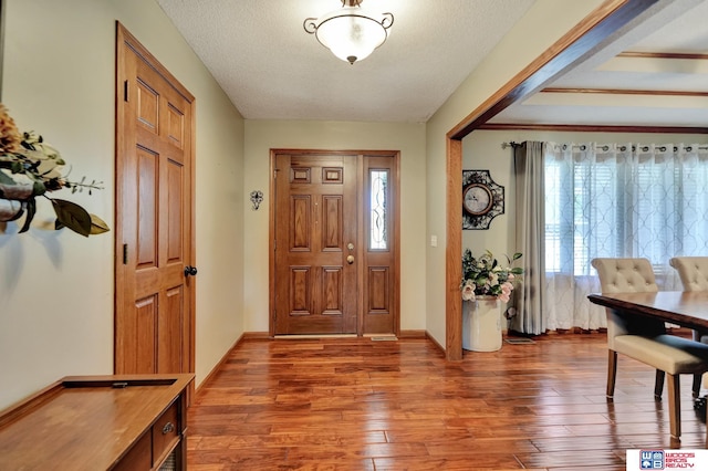 1714 S 14th Circle Dr, Beatrice, NE 68310 - foyer featuring hardwood / wood-style flooring and a textured ceiling
