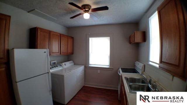 1941 J St, Lincoln, NE 68510 - clothes washing area featuring separate washer and dryer, cabinet space, a ceiling fan, healthy amount of natural light, and a textured ceiling
