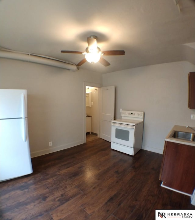1941 J St, Lincoln, NE 68510 - kitchen featuring white appliances, a sink, ceiling fan, dark wood-type flooring, and baseboards