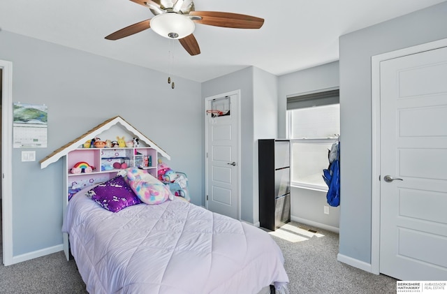 carpeted bedroom featuring baseboards and a ceiling fan