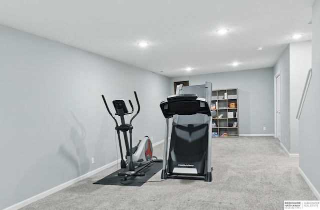 exercise area featuring baseboards, recessed lighting, and carpet