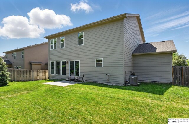 rear view of house featuring a patio area and central AC unit