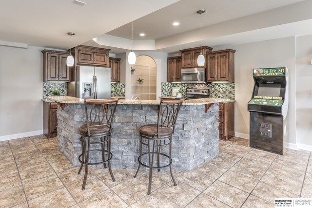 7309 S 196th Cir, Gretna, NE 68028 - kitchen featuring stainless steel appliances, tasteful backsplash, baseboards, and recessed lighting