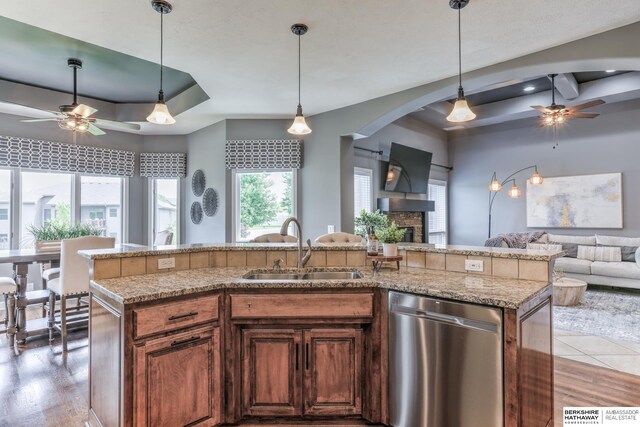 7309 S 196th Cir, Gretna, NE 68028 - kitchen featuring stainless steel dishwasher, a tray ceiling, and ceiling fan