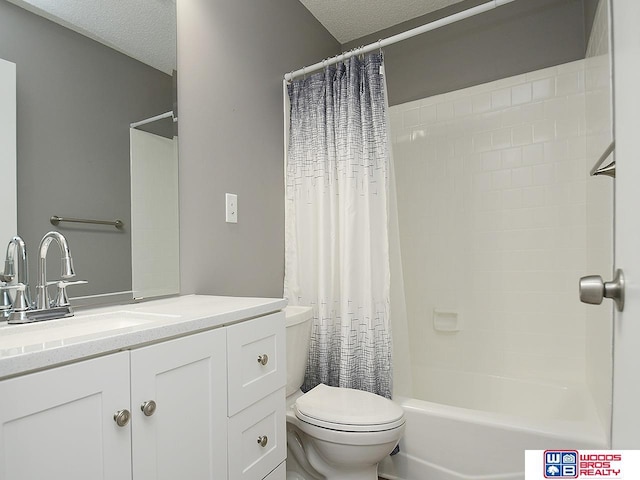 bathroom featuring a textured ceiling, toilet, vanity, and shower / bath combo with shower curtain