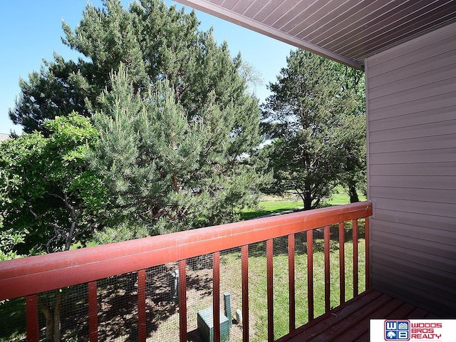 wooden deck with a yard