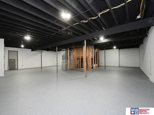 basement featuring heating unit