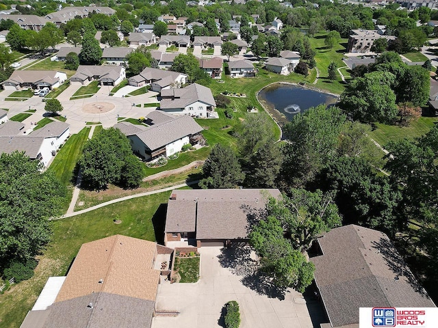 aerial view of property and surrounding area featuring nearby suburban area