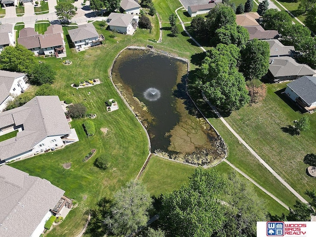 view of property location featuring nearby suburban area and a nearby body of water