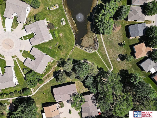 aerial view of property and surrounding area with nearby suburban area