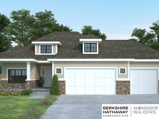 view of front of house with stone siding, concrete driveway, and an attached garage