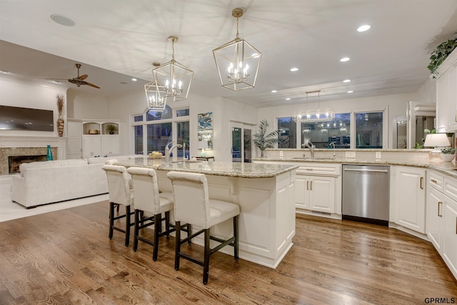 3835 S 179th Ter, Omaha, NE 68130 - kitchen with dishwasher, recessed lighting, open floor plan, white cabinets, and wood finished floors
