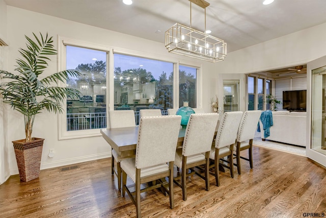 3835 S 179th Ter, Omaha, NE 68130 - dining room with a chandelier, recessed lighting, wood finished floors, and baseboards