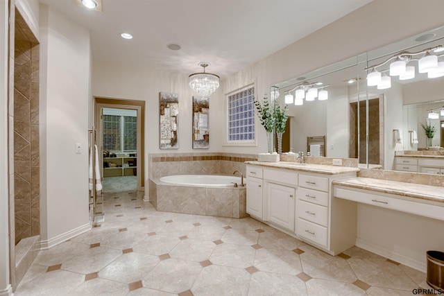 3835 S 179th Ter, Omaha, NE 68130 - bathroom with a garden tub, vanity, recessed lighting, a chandelier, and tile patterned floors