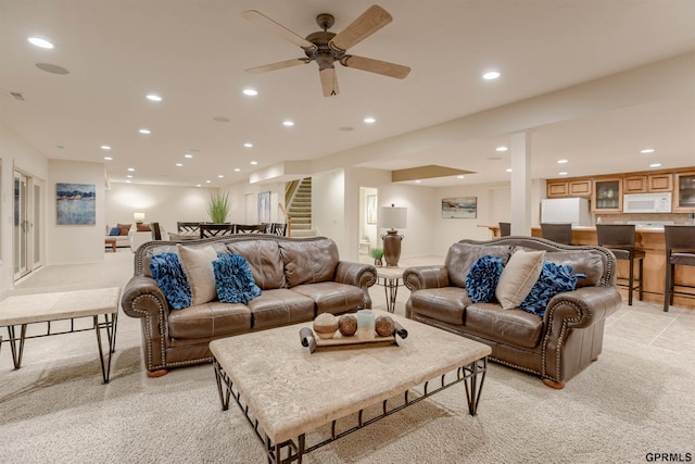 3835 S 179th Ter, Omaha, NE 68130 - living room with stairs, recessed lighting, light carpet, a ceiling fan, and bar